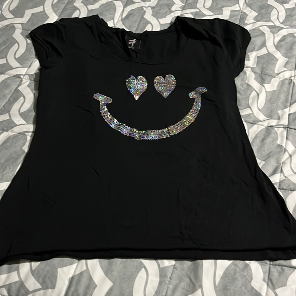 Woman’s black short sleeve shirt with silver  face in the front size xl 10.00